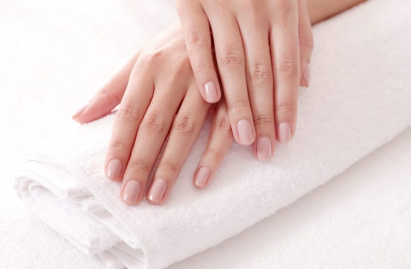 Skincare. Soft and clean hands on a white towel